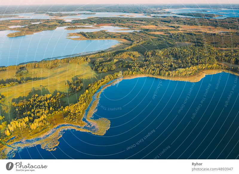 Braslaw Or Braslau, Vitebsk Voblast, Belarus. Aerial View Of Nedrava Lake And Green Forest Landscape In Sunny Autumn Morning. Top View Of Beautiful European Nature From High Attitude. Bird's Eye View. Famous Lakes. Natural Landmarks
