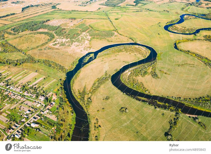 Golovintsy, Gomel region, Belarus. Aerial View Green Meadow And Curved River Landscape In Sunny Summer Day. Top View Of Beautiful European Nature From High Attitude