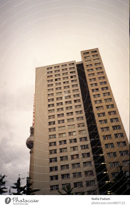The television tower peeks out from behind the skyscraper Analog Analogue photo Colour Colour photo Exterior shot Deserted Architecture