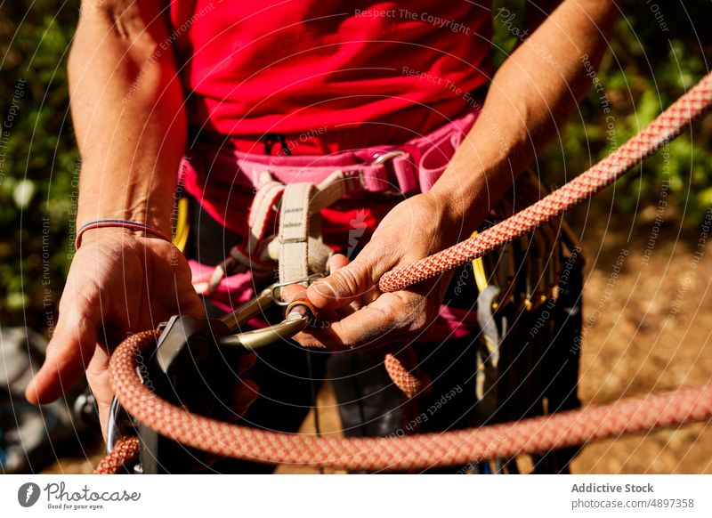 Anonymous Senior Woman Tying Rope On Waist - a Royalty Free Stock