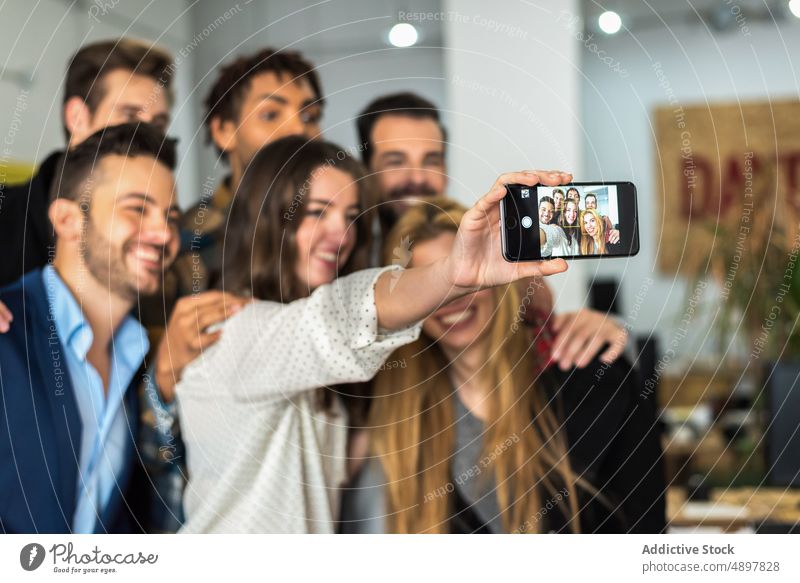 Cheerful diverse colleagues taking selfie in office businesspeople self portrait bonding smartphone group company work coworker positive workplace style memory