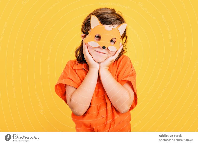 Cute girl in fox mask happy costume party cute carnival colorful bright touch face holiday celebrate vivid kid vibrant festive adorable child childhood event