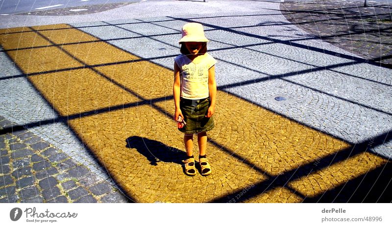 Orange Sun Child Light Cap Structures and shapes Places Shadow Cobblestones Brash
