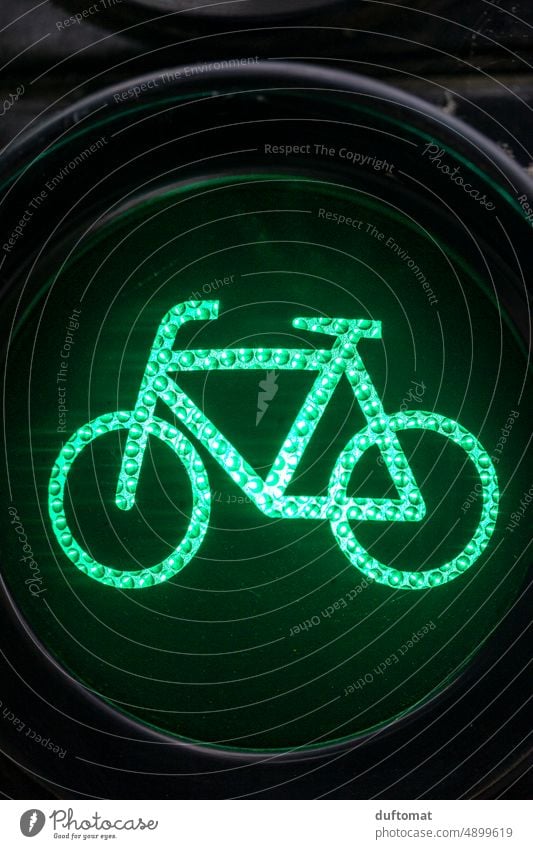 Bicycle traffic light on green Wheel Green Traffic light free ride Traffic infrastructure Street Transport Road traffic Town Exterior shot Means of transport