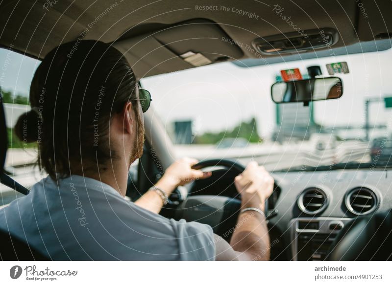 Man driving a car traveling roadtrip drive driver lifestyle highway journey man people speed sunglasses taxi traffic transportation vacation road trip street