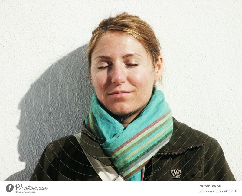 White wall in Andalusia Wall (building) Plaster Blonde Red-haired Scarf Jacket Autumn Turquoise Stripe Closed Sunbathing Calm Relaxation Pin army Shadow redhead
