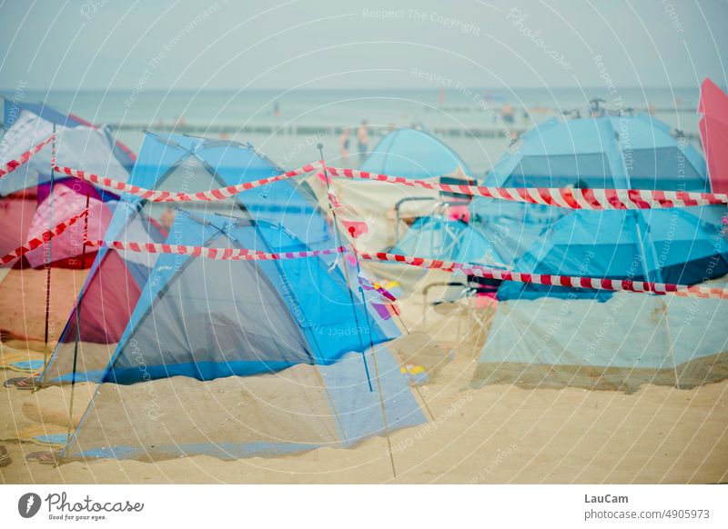 Beach closure - closed due to overcrowding blocking interdiction Ocean coast Full Crowded Tourism Summer Tourists Tent Tents wind deflector cordon barrier tape