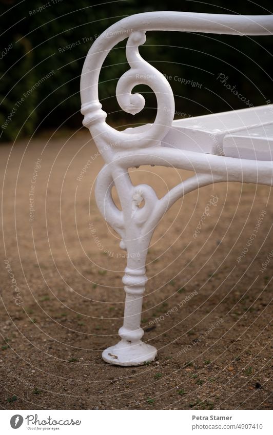 Ornate backrest of white park bench Park bench Bench White Curlicue squiggled Seating Sit Rest bench Relaxation Calm Break Wooden bench Nature Deserted