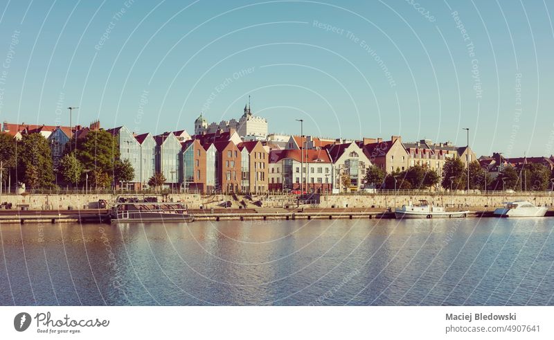 Szczecin waterfront with clear blue sky at dawn, retro color toning applied, Poland. city cityscape castle river panorama old town Stettin building skyline