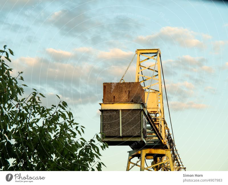 Crane in sunlight Weight Lifting crane Industry Counterweight Sky Work and employment Heavy Logistics industrial romance Technology Concrete Steel Construction