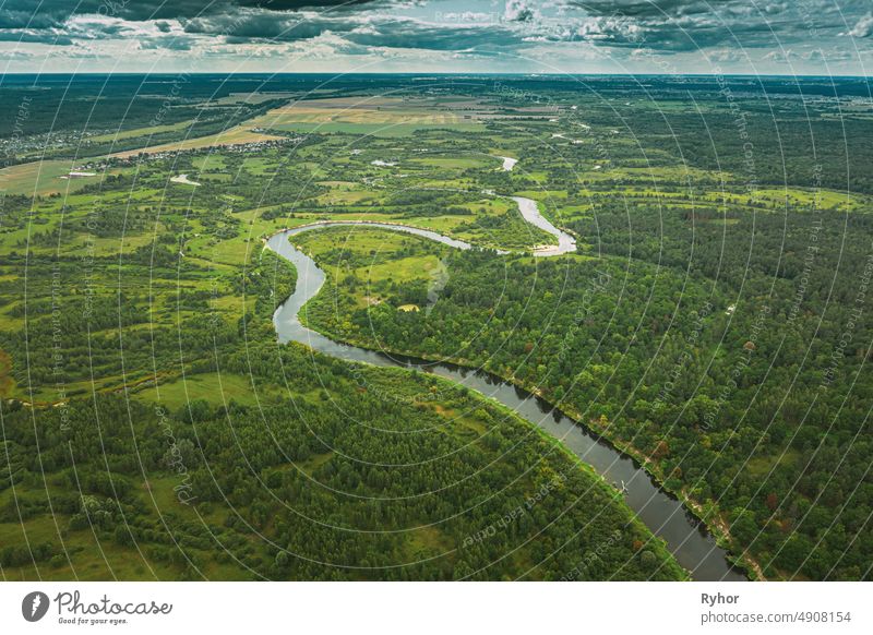 Aerial View Green Forest Woods And River Landscape In Summer Evening. Top View Of Beautiful European Nature From High Attitude In Summer Season. Drone View. Bird's Eye View