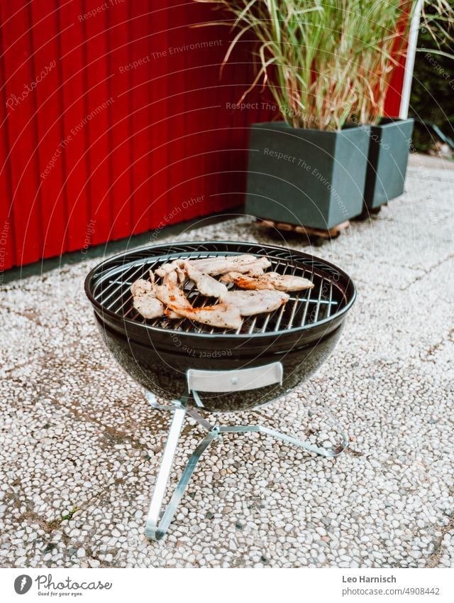 Barbecue in the garden BBQ Arbour Wooden house Swedish red Swedish house washed concrete Barbecue (apparatus) Meat tepid Summer Food BBQ season Nutrition Grill