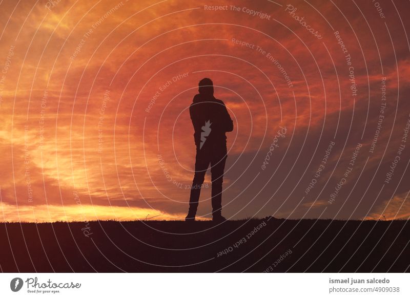 man trekking in the mountain with a beautiful sunset background person one person shadow silhouette nature landscape view sunlight traveling walking hiking