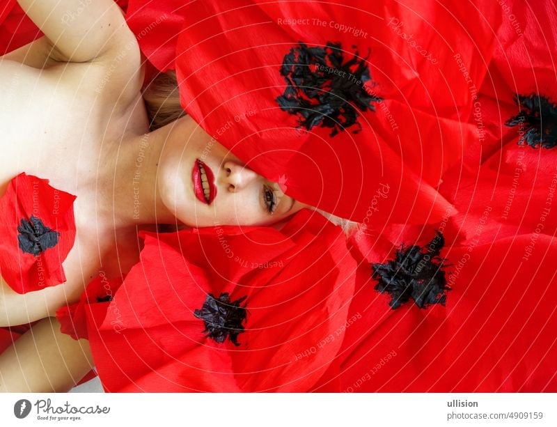 portrait of beautiful young sexy blonde woman with fashion red paper poppies vogue copy space mouth passion perfect sensuality red lips modern seductive erotic