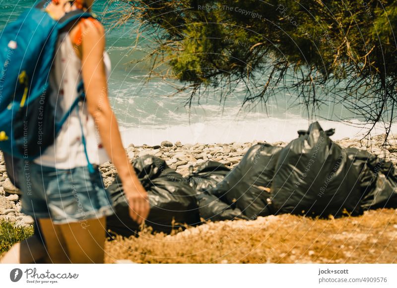 Wanderlust - past the wantonly left trash Woman short pants Backpack Ocean Surf Garbage bag Nature Waves Tree Sunlight Environmental pollution Warmth Summer