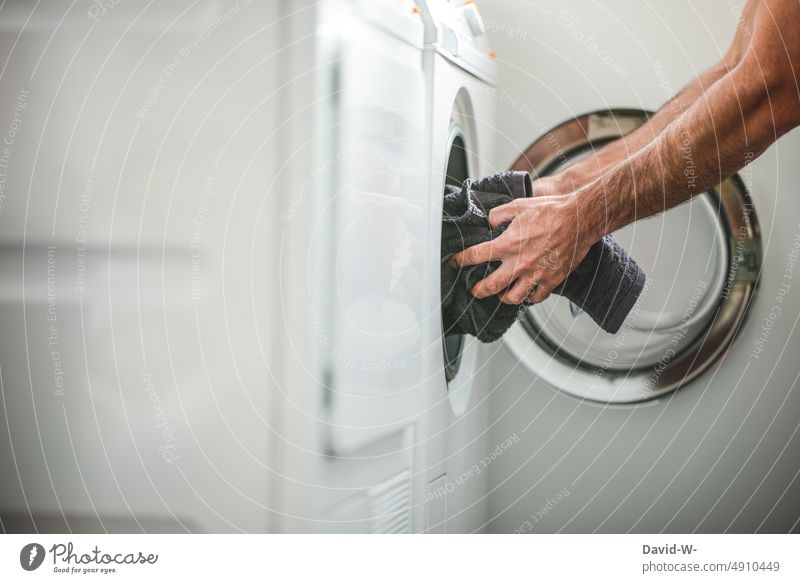 Getting laundry out of the washing machine Laundry Washer Man Grasp Washing day Household hands Househusband Power consumption Energy Photos of everyday life