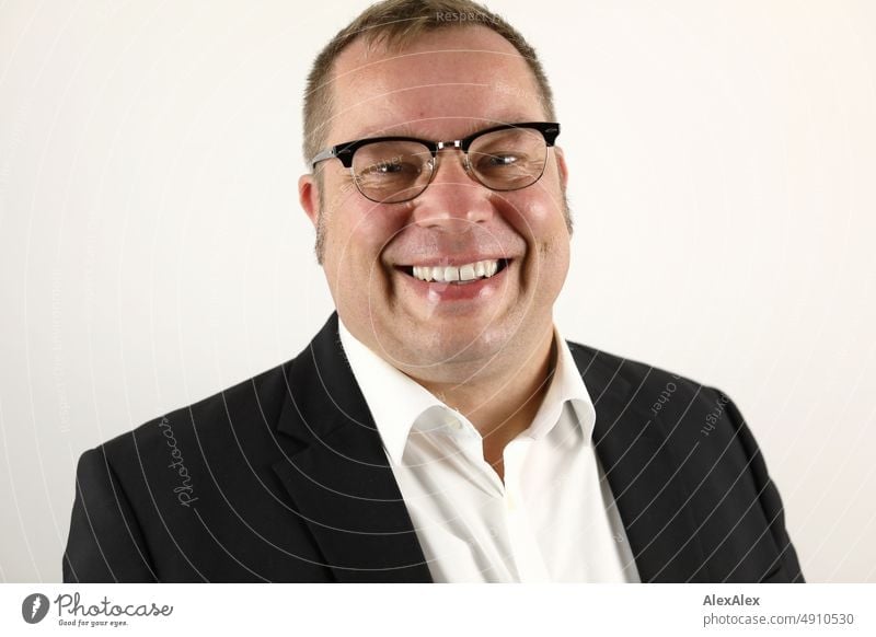 Portrait of man in suit with glasses smiling at camera. Profession Lifestyle Economy Office Work and employment Good pretty Upper body 35-50 years Interior shot