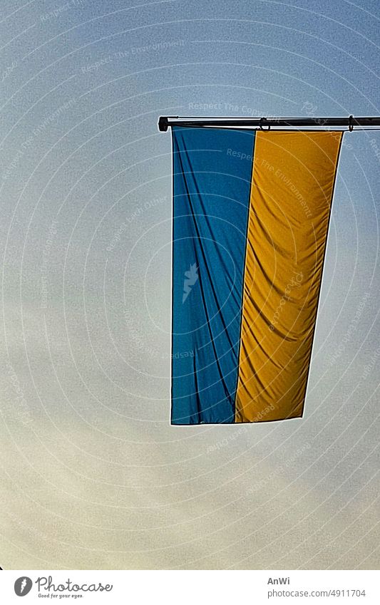 Ukrainian flag at dusk Ukraine Flag Blue Yellow symbol Freedom Solidarity Sign Peace Wish Hope Twilight windless grey sky Blue-yellow Ensign Ukraine war War