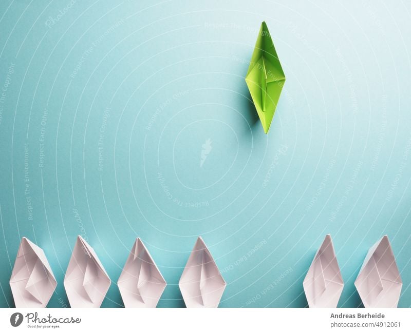 New ideas, creativity and various innovative solutions or leadership, ecology concept with paper boats green environment white business color compass