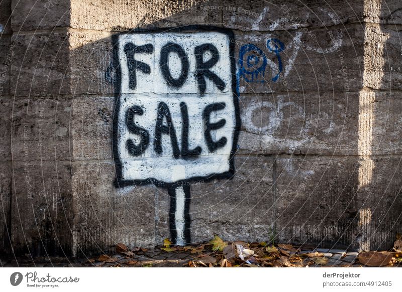 Wall with message: "For Sale Exterior shot Gloomy real estate Multicoloured Copy Space left Copy Space bottom Real estate market house purchase Tourism