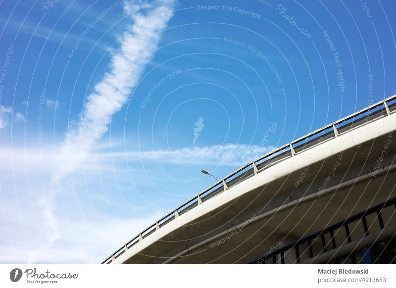 Picture of an overpass against the blue sky. highway road overbridge city transport trip travel safety view empty look up drive copy space nobody