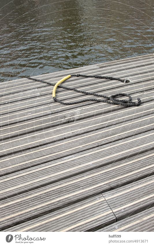 Rope on a jetty on a quiet canal investor Jetty Channel Gracht fix Release Depart forsake sb./sth. Loneliness Lonely Water Harbour Navigation River Dew