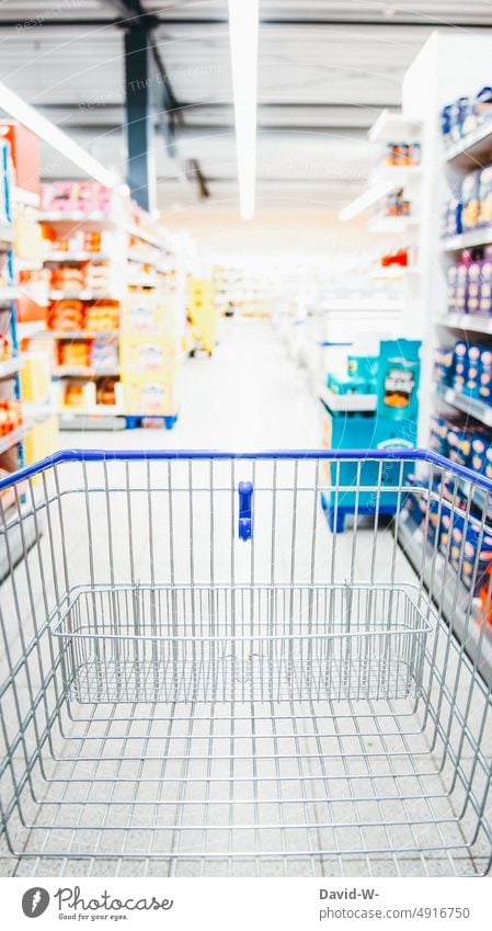 Shopping cart in store - at shopping Shopping Trolley Food Expensive purchasing Markets Supermarket Push Corridor Shelves Prices