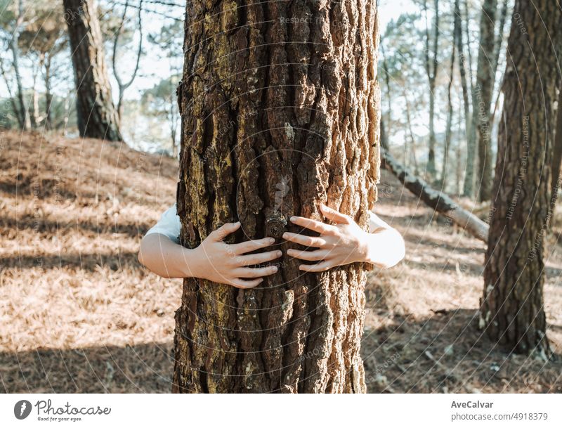 Young woman hug. Caring for and unity with nature. Ecology and saving the planet concept.nature and eco lifestyle - change the world - world's day and protection for life and planet
