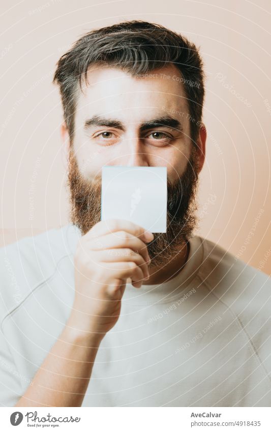 Young man holding a blank card to put your text, psychiatric help concept. You are not alone.Mental health, self help concept, Ask for help, talk to someone. Psychology