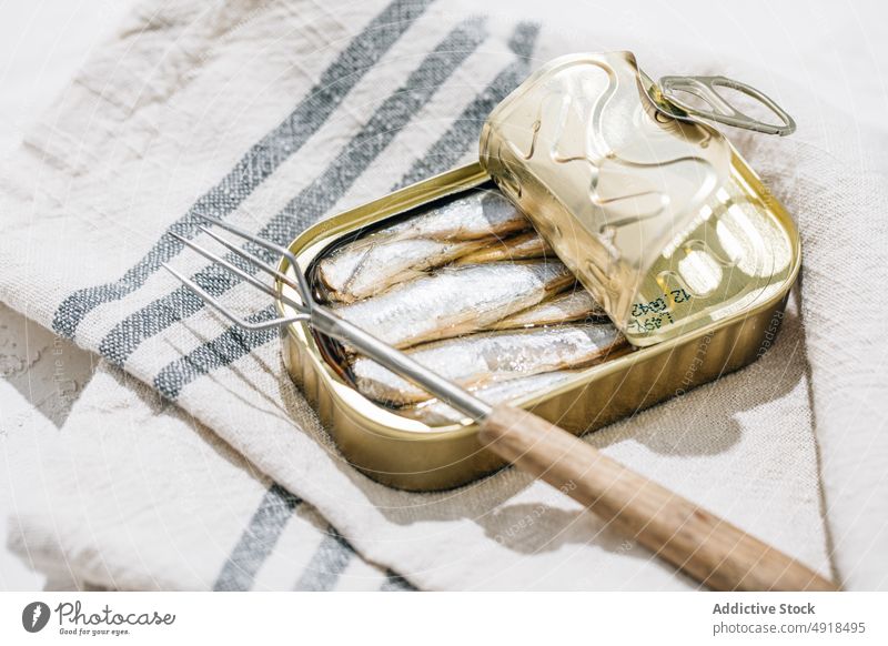 Closeup of a can of sardines metal tin conserve food seafood fish open metallic canned nutrition background isolated preserve product meal snack seal container