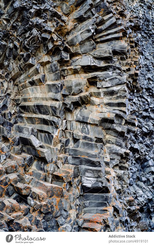 Natural background of basalt cliff with textures surface rock abstract formation geology nature pattern rough uneven solid natural massive grunge mineral