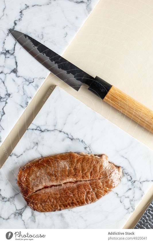 Fried kobe prefecture wagyu beef meat japanese traditional culinary knife fried scrumptious flavor appetizing palatable cutting board tasty delicious cuisine