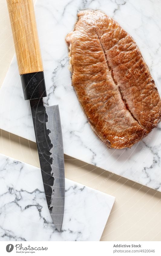Fried kobe prefecture wagyu beef meat japanese traditional culinary knife fried scrumptious flavor appetizing palatable cutting board tasty delicious cuisine