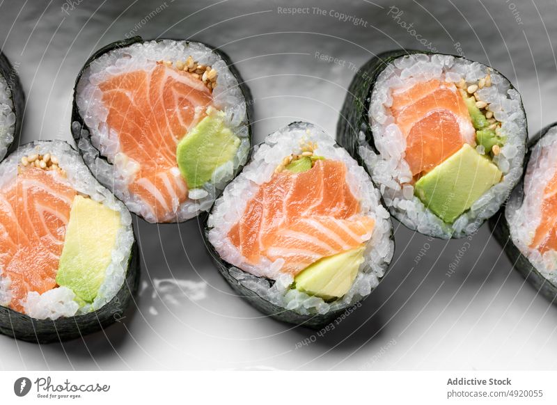 Delicious Futomaki Norwegian rolls with salmon japanese sushi futomaki norwegian set avocado seafood fish traditional culture dish rice meal yummy appetizing