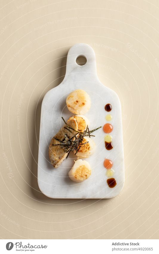 Scallops with foie gras on marble cutting board scallop seafood dish cuisine delicacy sophisticated haute cuisine exquisite ingredient serve fried delicious