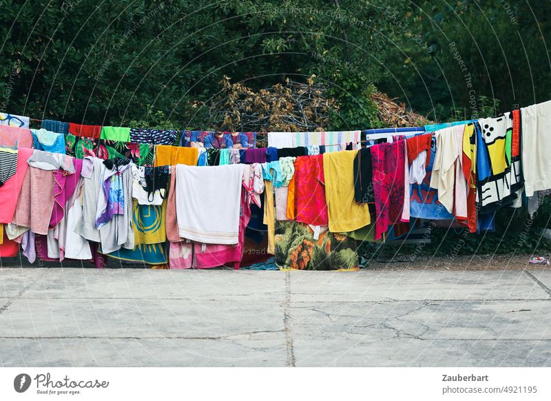 Many colorful towels on the clothesline Towel Towels variegated leash Hang Laundry bathe fun Dry Washing Washing day variety Coloured underwear Hang up