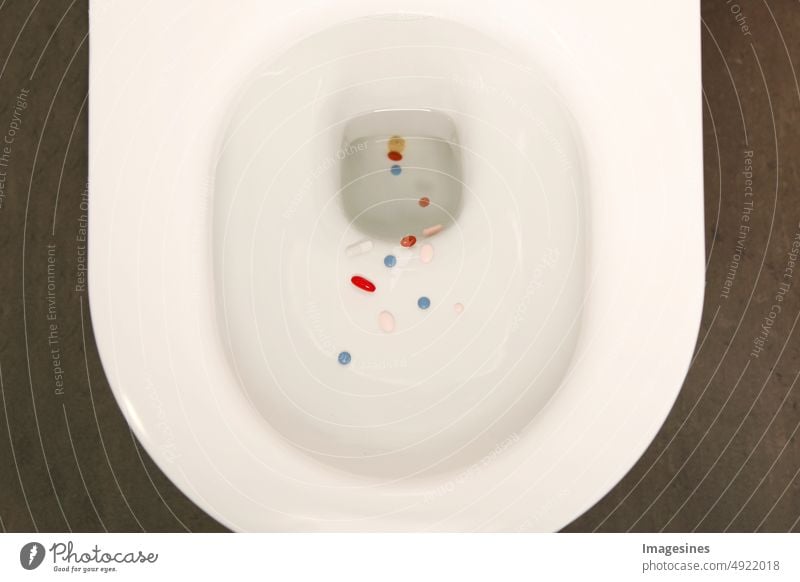 Dispose of medications in the toilet. Placebo effect. white toilet bowl, old, unused, unwanted, expired, medicines, pills, capsules and tablets in the toilet flush does not work at all. environment, pharmacy, medicine concept