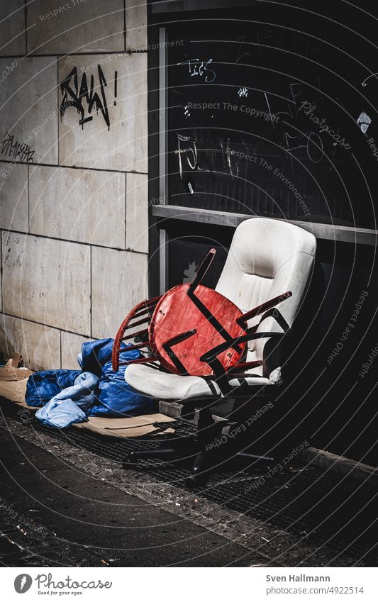 Chair sits on chair on the street Bulk rubbish Trash Street Shadow Deprived area Ghetto Plastic Transience Exterior shot Throw away Recycling Refuse disposal