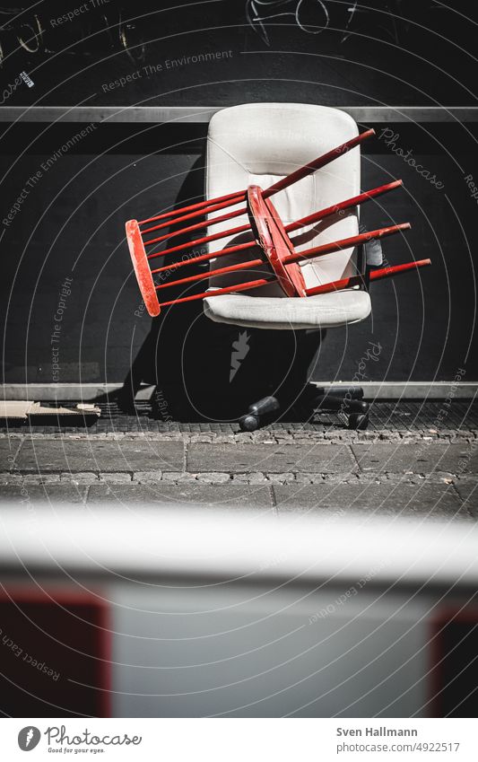 Chair sits on chair on the street Bulk rubbish Trash Street Shadow Deprived area Ghetto Plastic Transience Exterior shot Throw away Recycling Refuse disposal