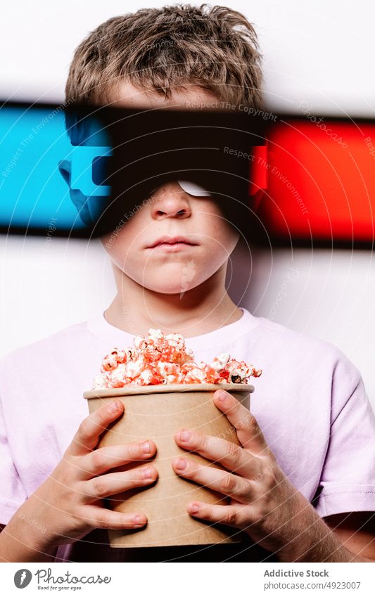 Through 3D glasses of boy with popcorn 3d lens kid amusement snack colorful treat appetizing hobby yummy cinema food entertain flavor delicious tasty childhood