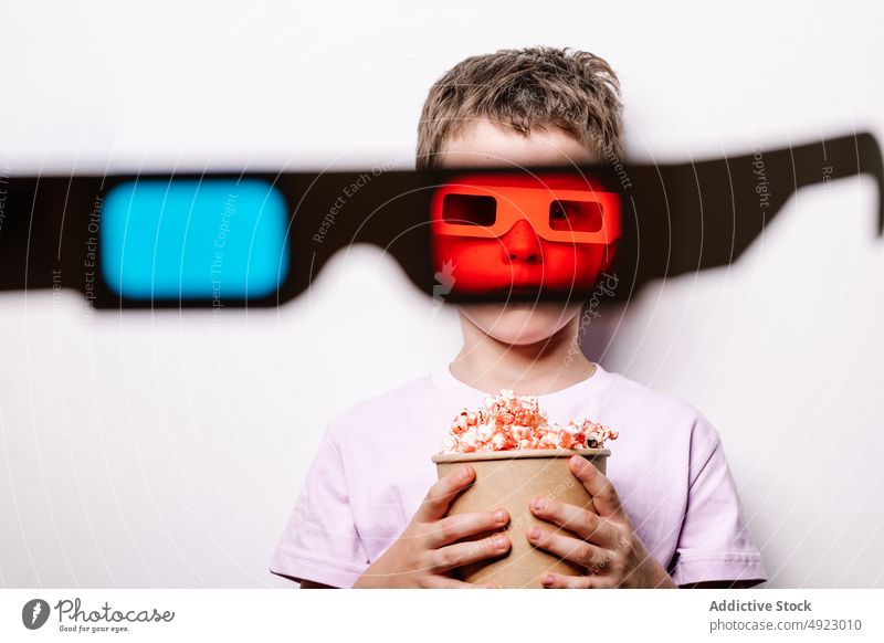 Through 3D glasses of boy with popcorn 3d lens kid amusement snack colorful treat appetizing hobby yummy cinema food entertain flavor delicious tasty childhood