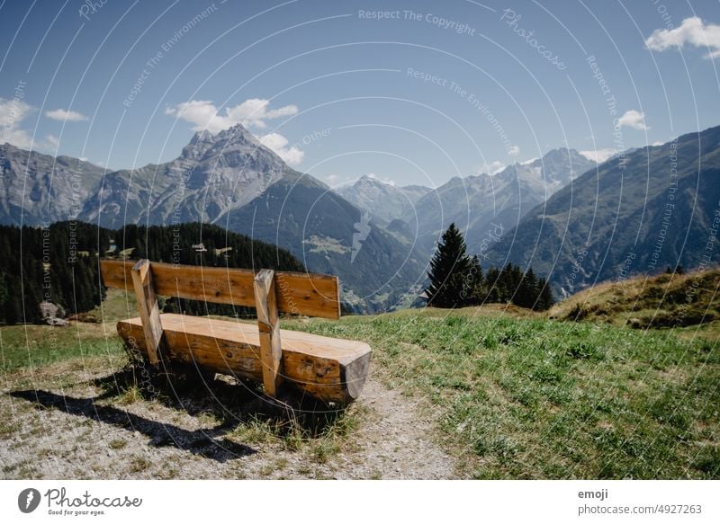 Bench with view of the mountains in Uri, Switzerland Vantage point Clouds panorama Hill Weather Tourism central switzerland little cloud Mountain