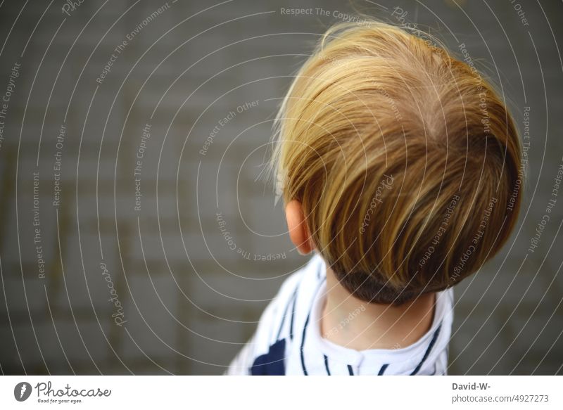 Child looks thoughtfully in one direction Observe Think Anonymous Boy (child) Head Meditative Looking Dream Rear view Back of the head