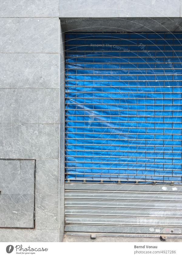 Closed store with dull facade Facade Gloomy Vacancy Store premises Blue Gray Tile Wall (building) Deserted House (Residential Structure) Building Exterior shot