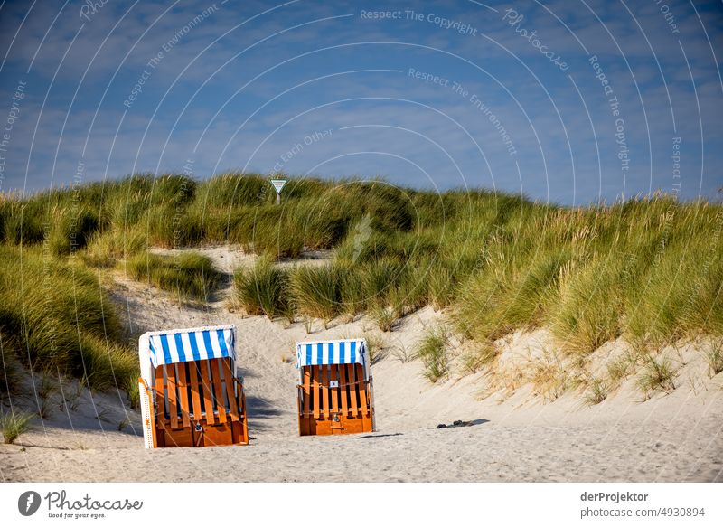 Beach chairs in front of dune in Helgoland nature reserve Vacation destination Deserted Schleswig-Holstein coast North Sea Beautiful weather Germany Island