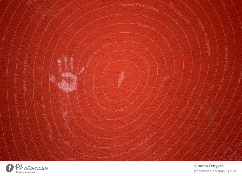 Handprint on the red wall of the house "Hello." handprint Red warm structure Graffiti right hand 5 fingers open hand Tracks transient Colour photo details