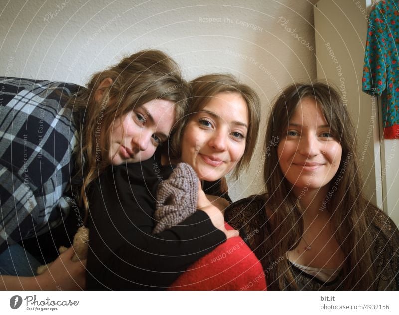 Three teenagers, long haired and cheerful. Sisters laughing at the camera. Girl Youth (Young adults) Happy fortunate Laughter Family & Relations Happiness