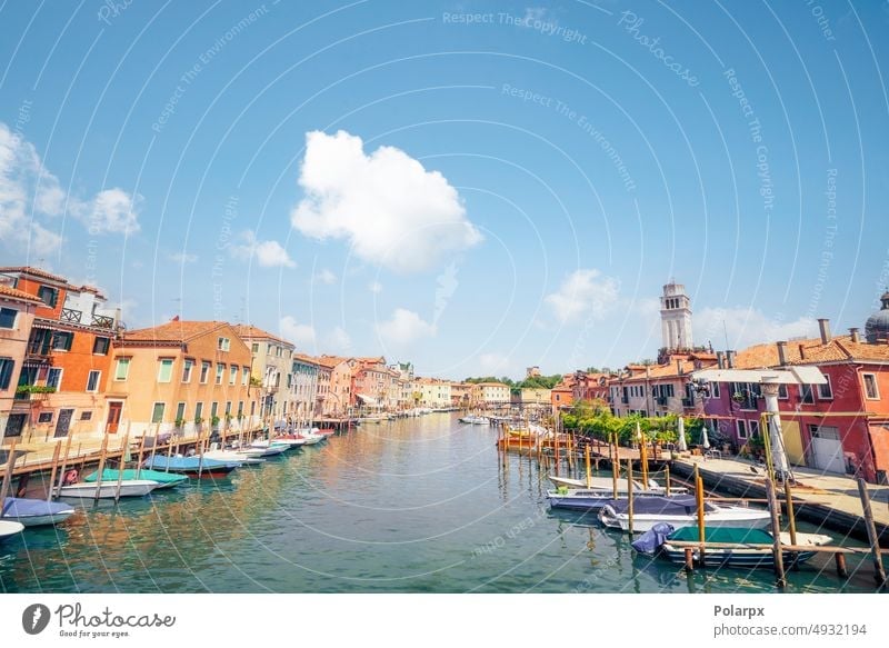 Fishing boats in the water in Venice sunny illuminated tower editorial transport people transportation gondolas tourists building view adriatic sky bridge
