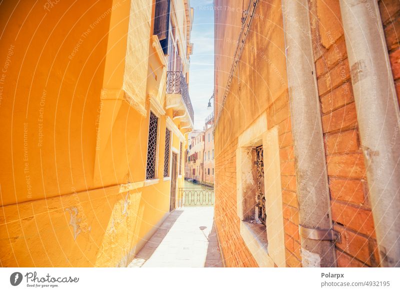 Yellow brick buildings in Venice, Italy medieval orange structure culture stone color beautiful scene town archway sunlight daytime renaissance romantic