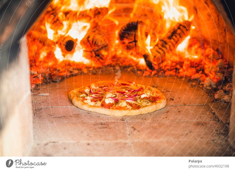 Pizza with toppings in a hot stone oven stove outdoors italian food wood fire pastries calorie neapolitan margherita hungry rotary shovel original ovens lunch